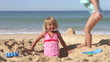 Two Young Girls Playing On Beach Together