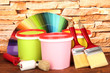 Set for painting: paint pots, brushes, paint-roller, palette of