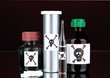Deadly poison in bottles on black background