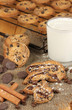 Chocolate cookies on the baking with glass of milk close up