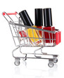 Cosmetics in cart isolated on white