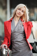 Young businesswoman walking on the city street