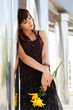 Photo: Sad young woman with a flowers Sad young woman with a flowers