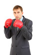 Businessman in boxing gloves isolated on white
