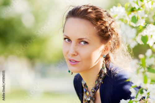 Photo: Beautiful woman in a spring garden Beautiful woman in a spring garden