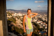 girl look beautiful landscape of rocks and villas in sunset time