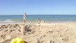 Two Young Girls Playing On Beach Together