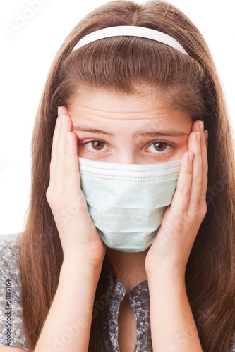 Photo: Teenager girl in surgical mask Teenager girl in surgical mask