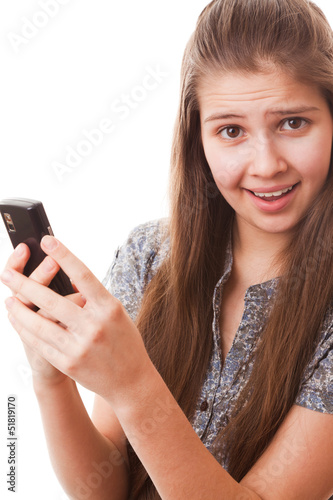 Photo: Teenager girl and mobile phone Teenager girl and mobile phone