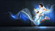 Photo: young man playing on electro guitar and jumping young man playing on electro guitar and jumping