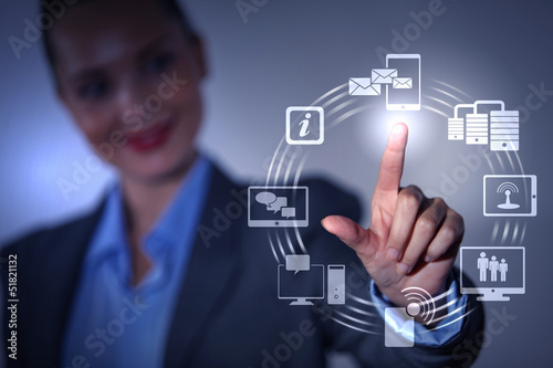 Photo: hand pushing on a touch screen hand pushing on a touch screen