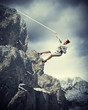 businesswoman climbing mountain