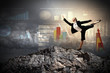 businesswoman standing atop of mountain
