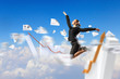Photo: businesswoman in black suit jumping businesswoman in black suit jumping