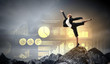 businesswoman standing atop of mountain