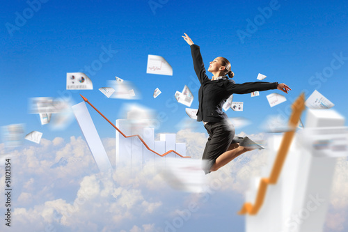 Photo: businesswoman in black suit jumping businesswoman in black suit jumping