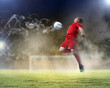 football player striking the ball