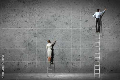 Photo: businesspeople drawing diagrams on wall businesspeople drawing diagrams on wall