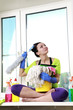 Foto: Women cleaning a window Women cleaning a window