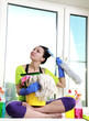 Foto: Women cleaning a window Women cleaning a window