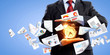 Foto: Business man holding alarmclock Business man holding alarmclock