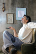 smiling man with remote control