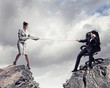 Photo: People pull the rope. People pull the rope.