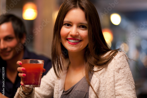 Photo: Woman holding a cocktail glass Woman holding a cocktail glass
