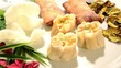 chinese dumplings, spring rolls and shrimp chips