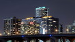 Time lapse of urban scene at night with buildings and traffic