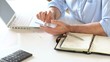 Closeup of businessman hands typing on smartphone
