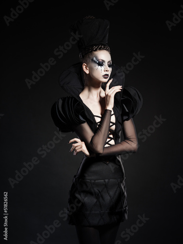 Photo: beautiful model posing as chess queen - fashion & beauty concept beautiful model posing as chess queen - fashion & beauty concept