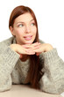 Photo: A young woman sitting at the desk, isolated on white background A young woman sitting at the desk, isolated on white background