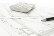 Blueprint with calculator and pen