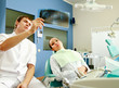 A dentist holding an x-ray