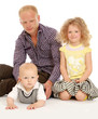 Peaceful family sitting on the floor