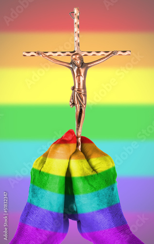 Photo: Old woman with catholic crucifix, isolated, rainbow flag pattern Old woman with catholic crucifix, isolated, rainbow flag pattern