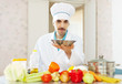 Photo: caucasian cook in uniform with plate caucasian cook in uniform with plate