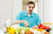  man cooking dinner with vegetables