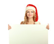 Beautiful christmas woman in santa hat holding