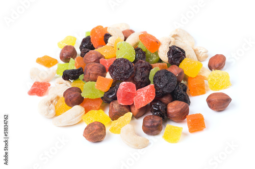 Photo: A mixture of dried fruits on a white background A mixture of dried fruits on a white background