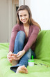 Happy woman looks to her toenails