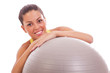 young woman holding fitness ball