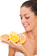 young healthy smiling woman with orange and lemons