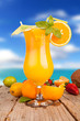 Fresh summer drink on wooden table with blur sea background