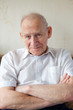 Smiling Senior Man With Crossed Arms