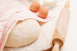 Dough on wooden board