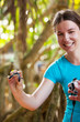 Newly hatched baby turtle in girls hand at Sea Turtles Conservat