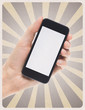 Mobile smartphone in hand on retro background