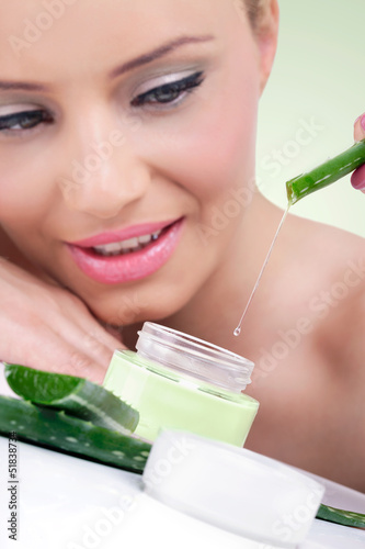 Photo: Young woman with natural aloe vera cream Young woman with natural aloe vera cream